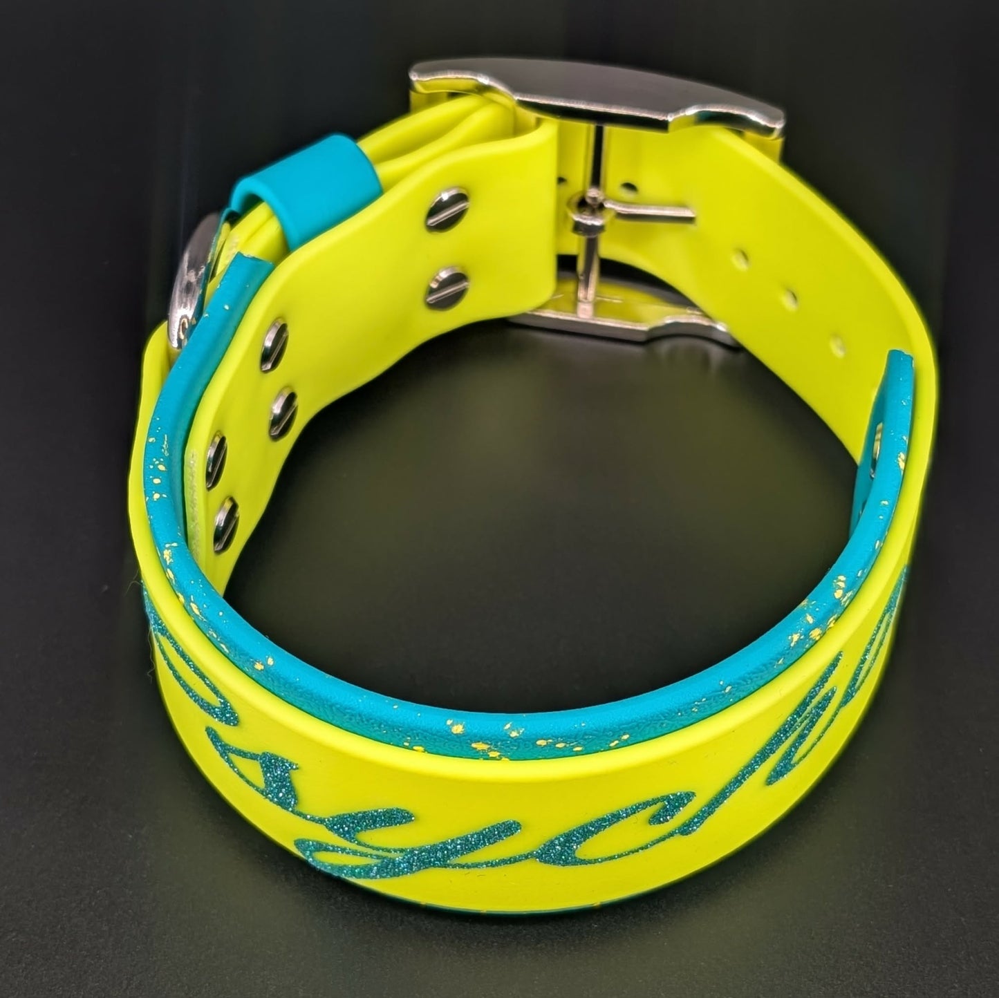 2 inch wide teal and yellow layered biothane dog collar with splatter paint psycho text