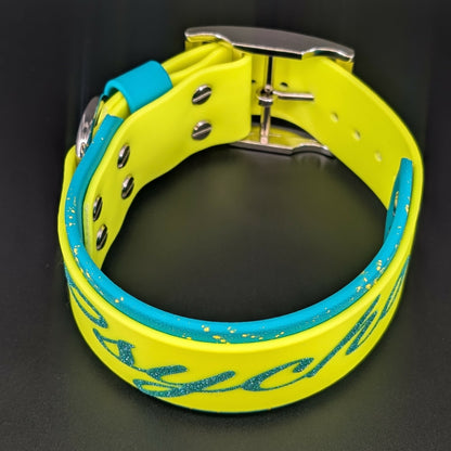 2 inch wide teal and yellow layered biothane dog collar with splatter paint psycho text