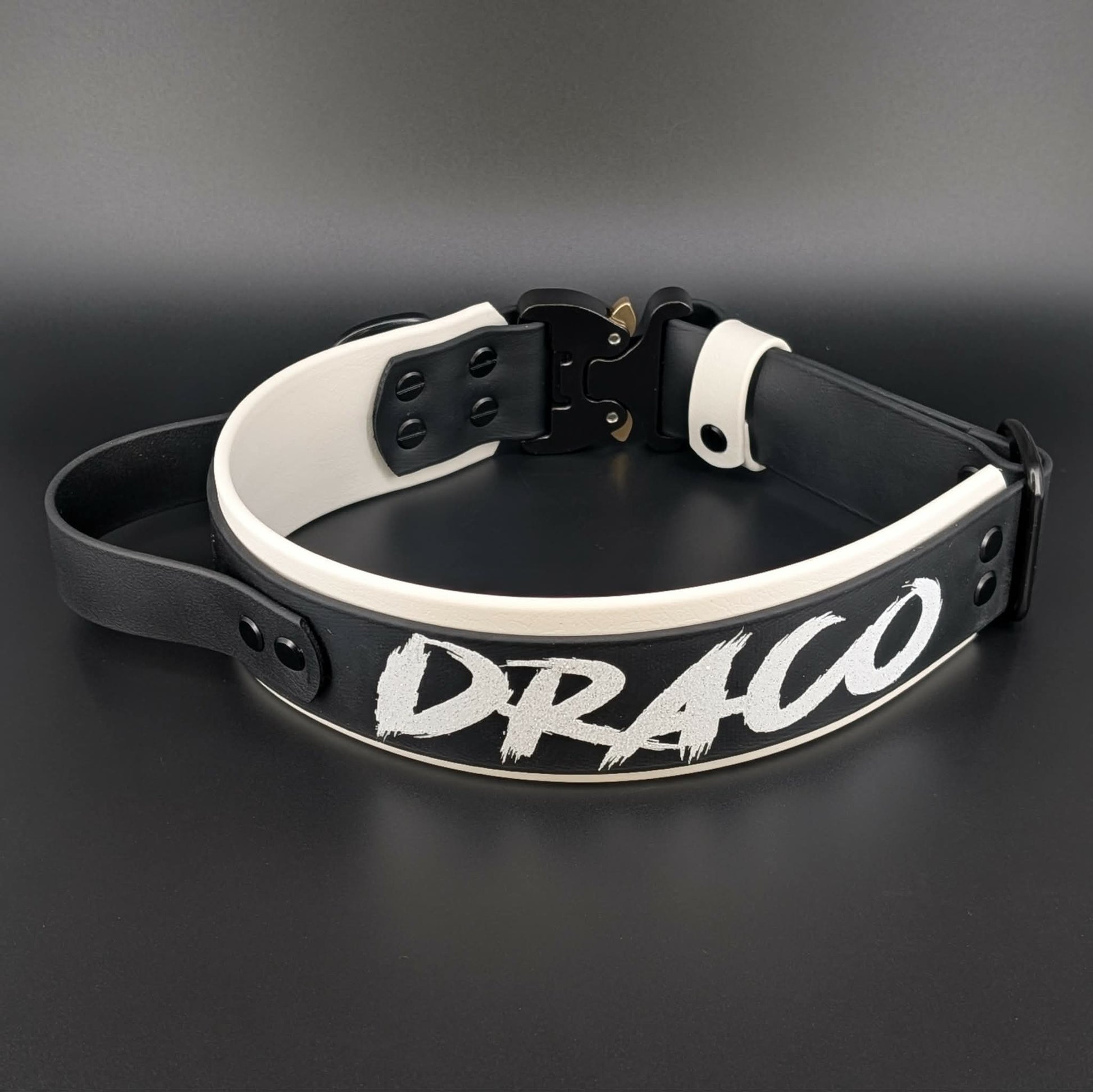 2 inch wide white and black layered biothane handle collar with quick release cobra buckle and custom text