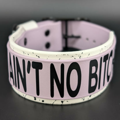 2 inch wide white and lavender layered biothane I aint no bitch dog collar with splatter paint