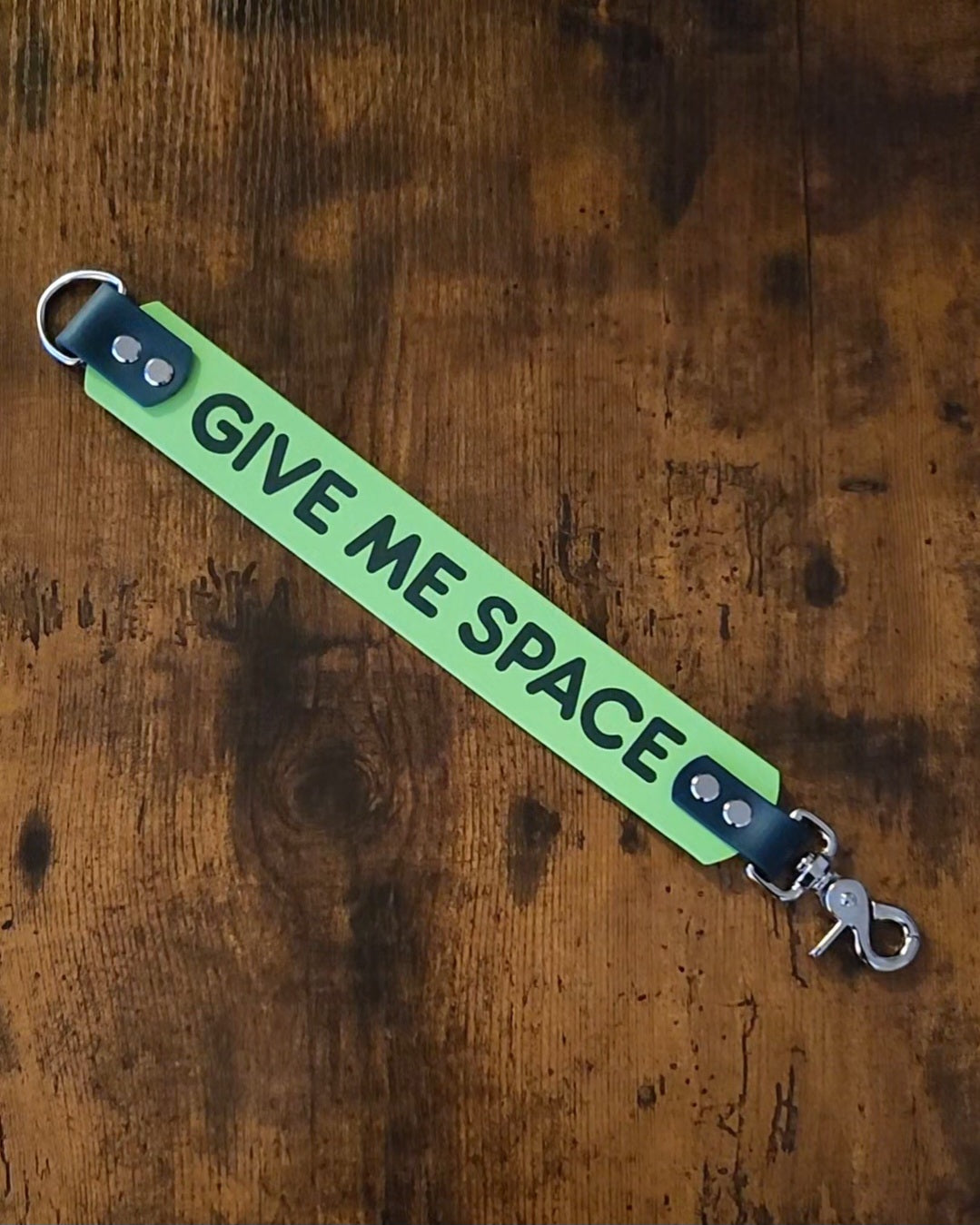 light and dark green biothane leash wrap reading "GIVE ME SPACE"