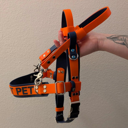 dark blue and orange biothane straight front service dog harness with built-in counterbalance handle and detachable pull strap