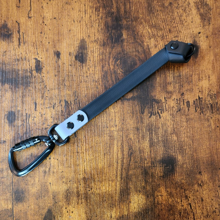 black and gray biothane knotted traffic tab with carabiner clip