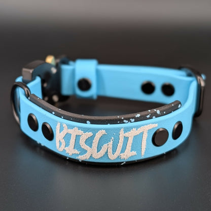 black and light blue layered biothane dog collar with splatter paint custom text and quick release cobra buckle