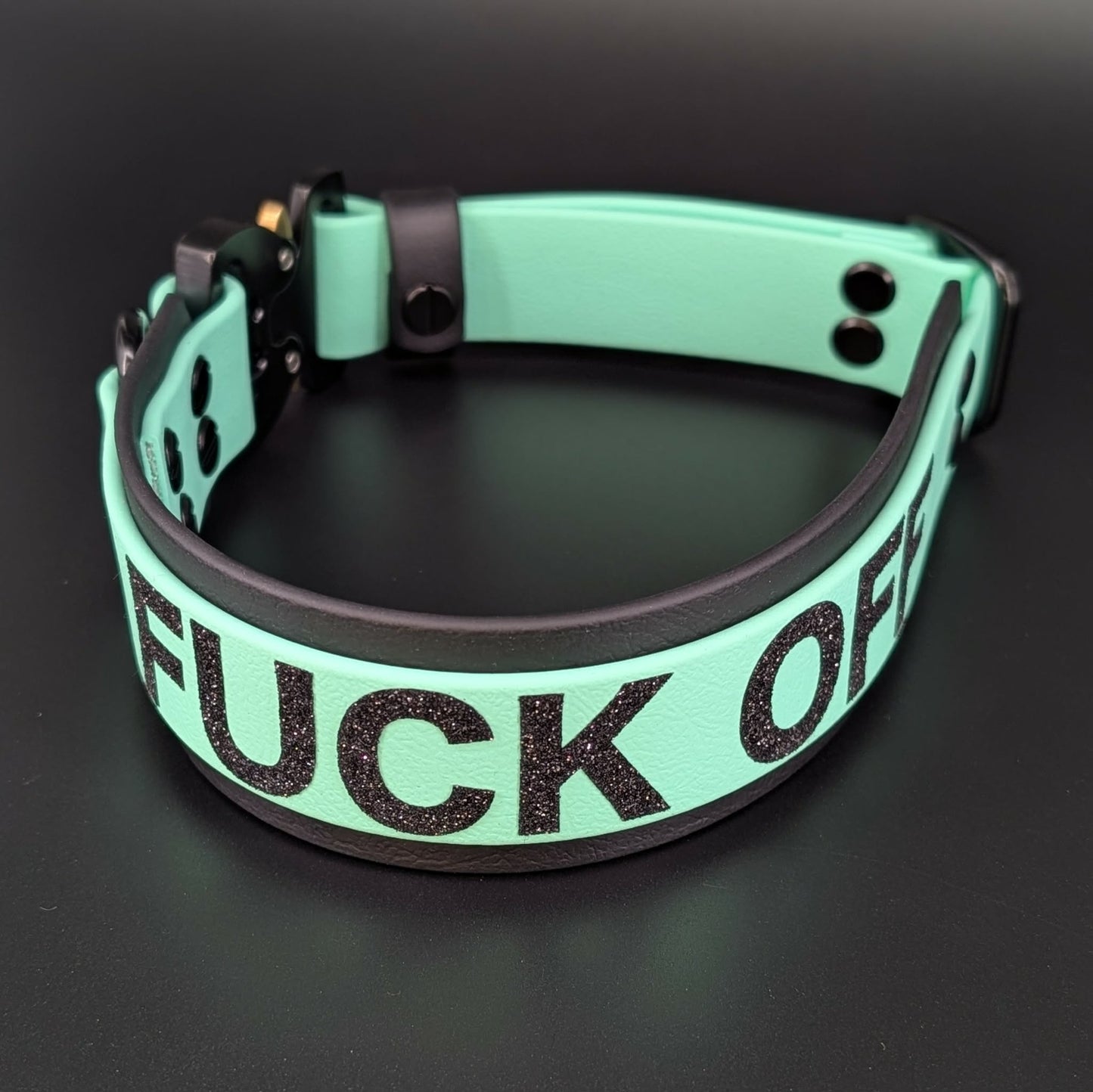 black and mint green layered biothane dog collar with quick release cobra buckle and fuck off text