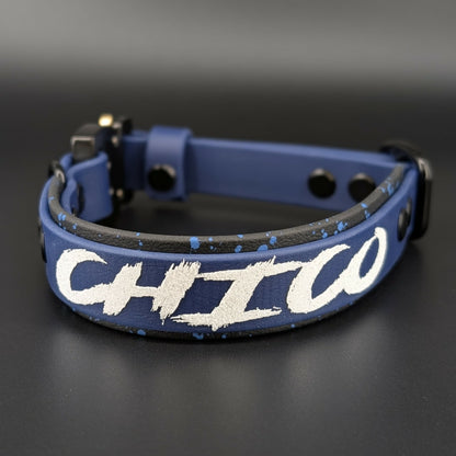 black and navy blue layered biothane dog collar with splatter paint custom text and quick release cobra buckle