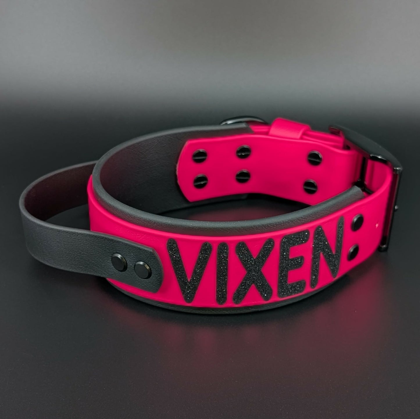 black and pink layered biothane dog collar with tactical handle and custom glitter text