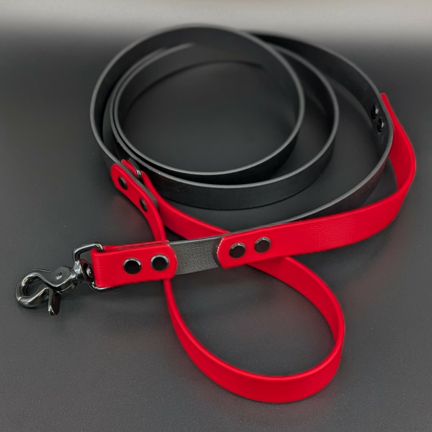 black and red biothane dog leash with built in traffic handle