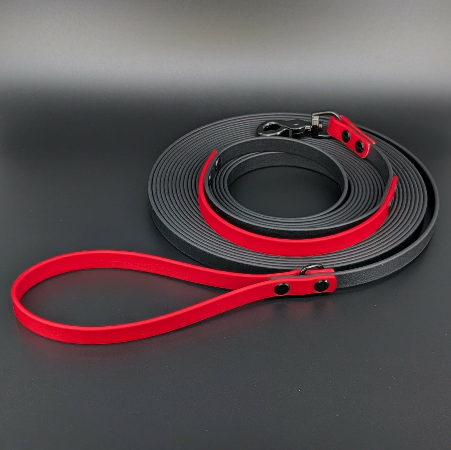 black and red biothane long line with built in traffic handle