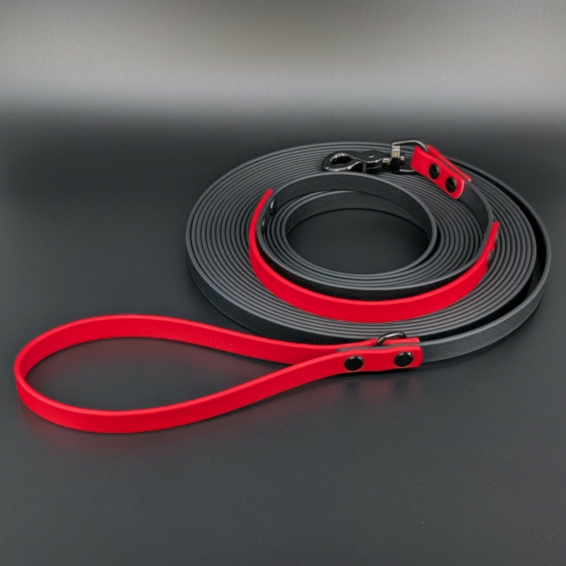 black and red biothane long line with built in traffic handle