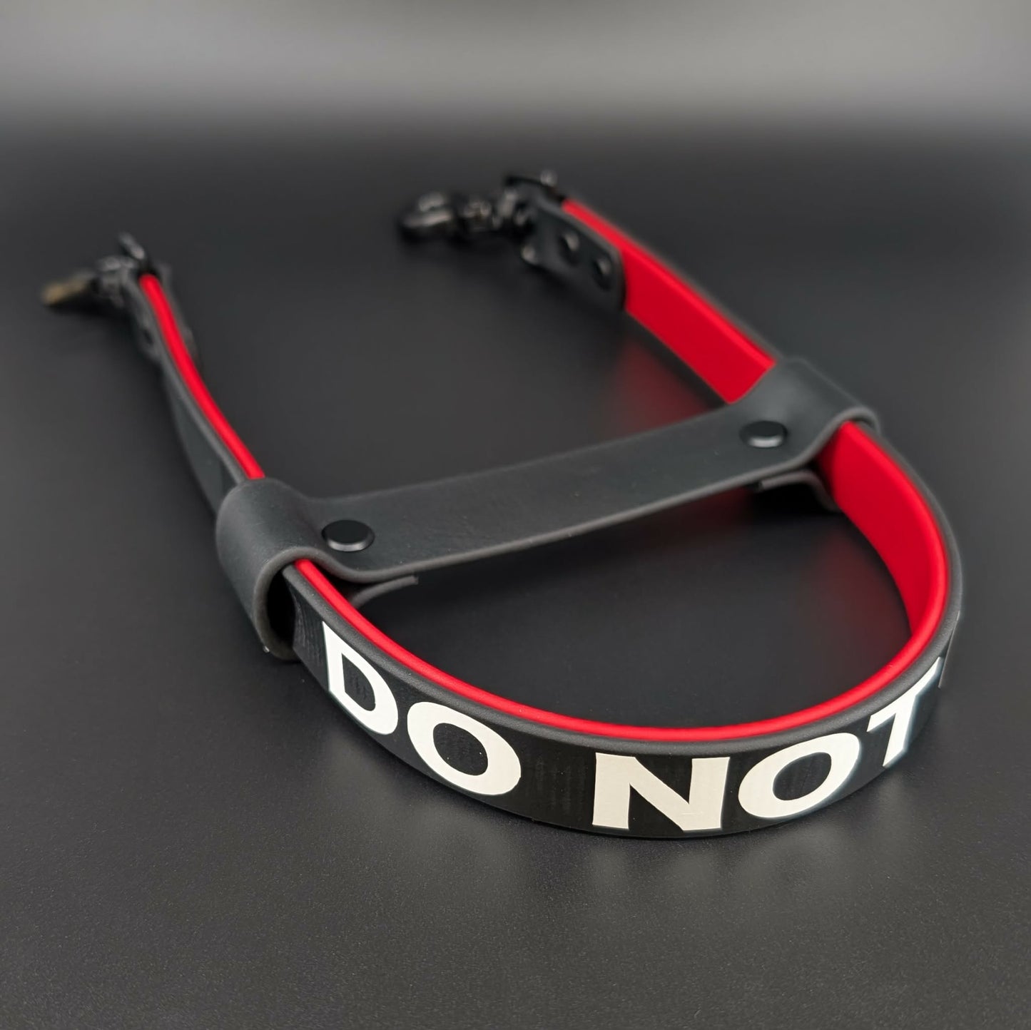 black and red layered biothane pull strap with do not pet text