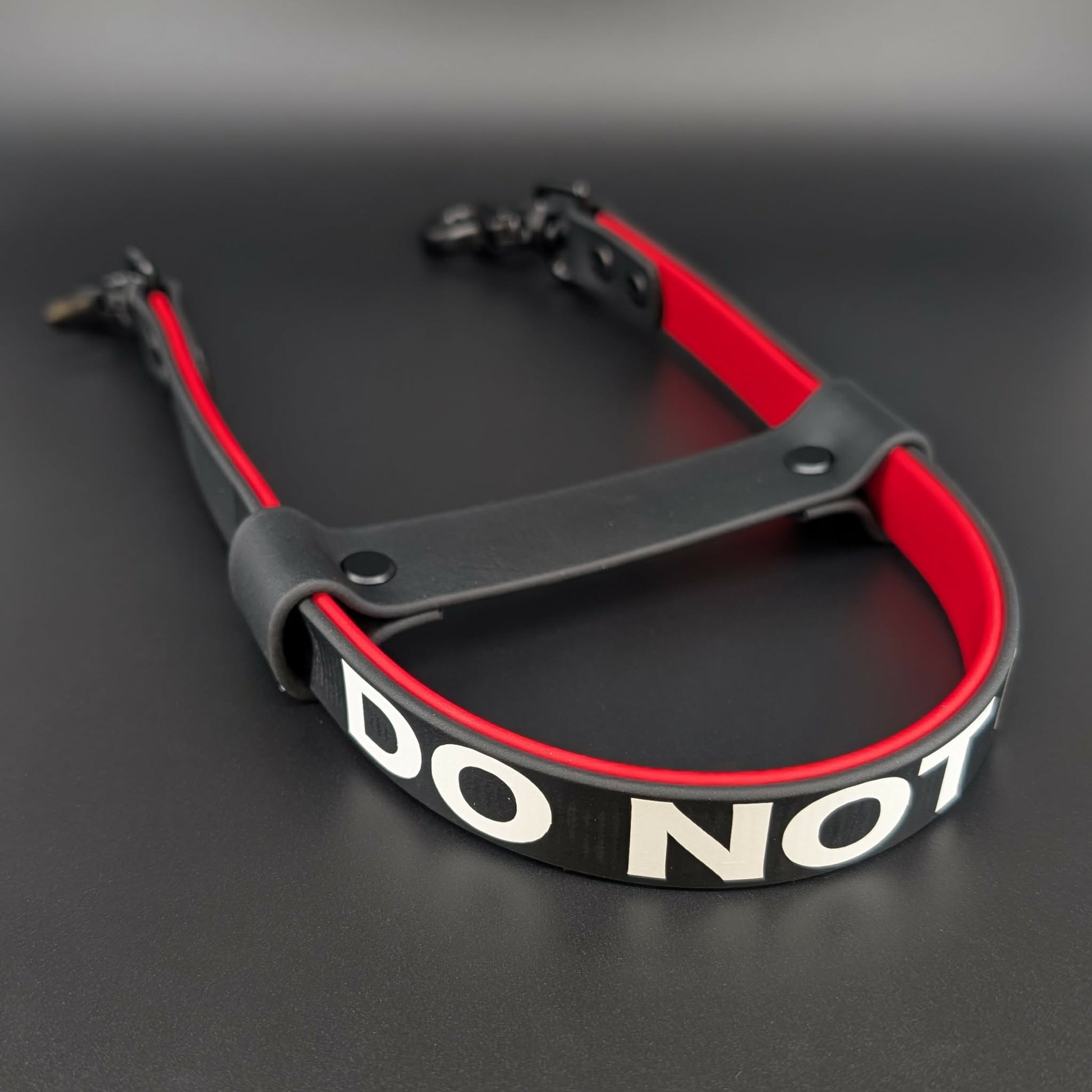 black and red layered biothane pull strap with do not pet text