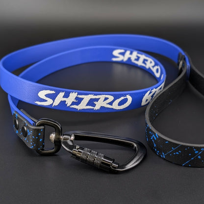 black and royal blue biothane dog leash with royal blue splatter paint and custom text