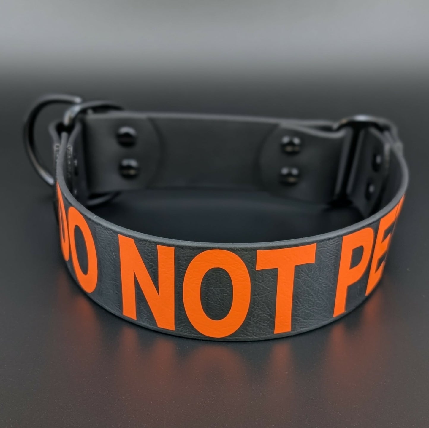 black biothane limited slip dog collar with orange do not pet text