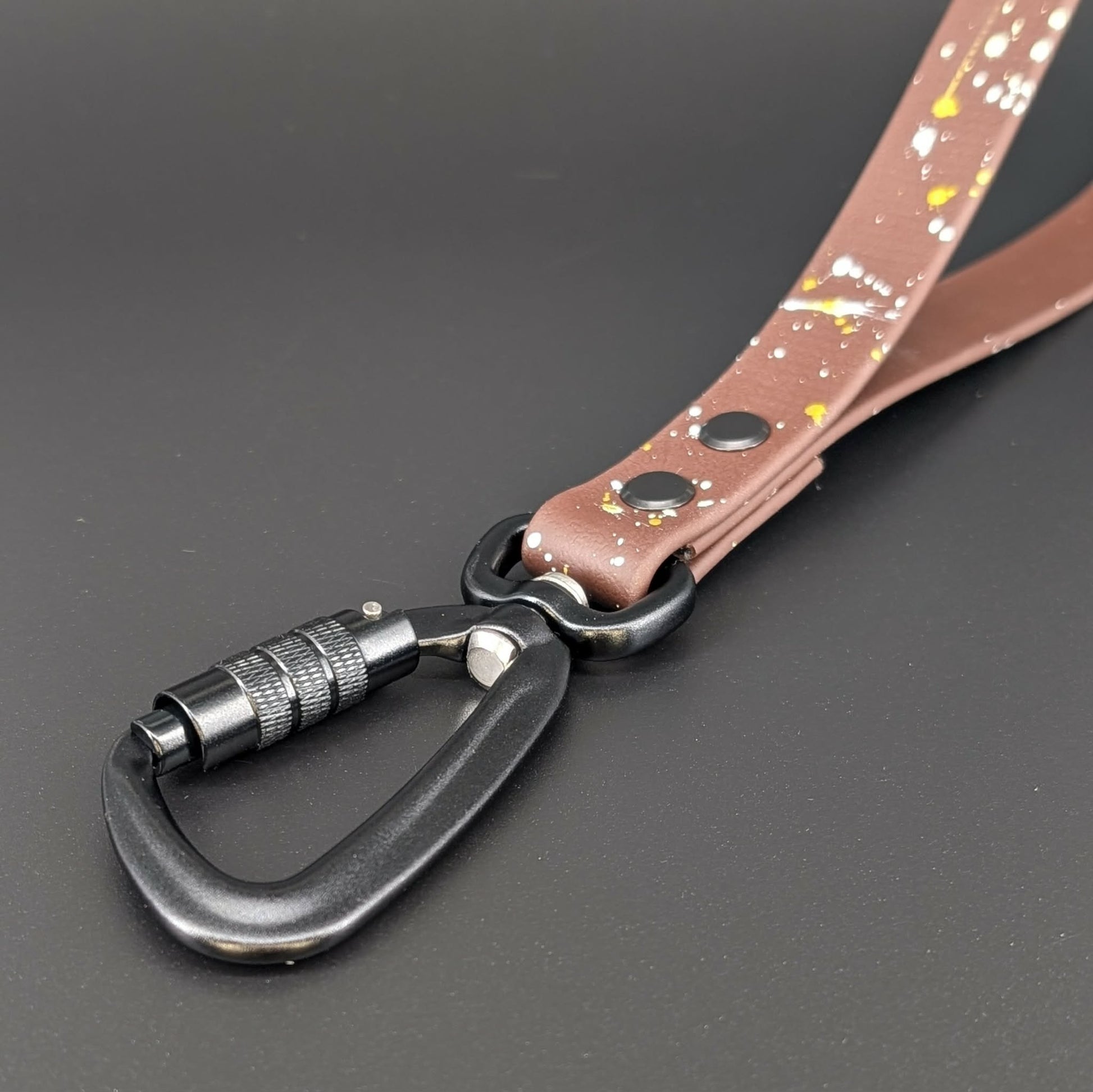black carabiner on dark brown biothane traffic handle