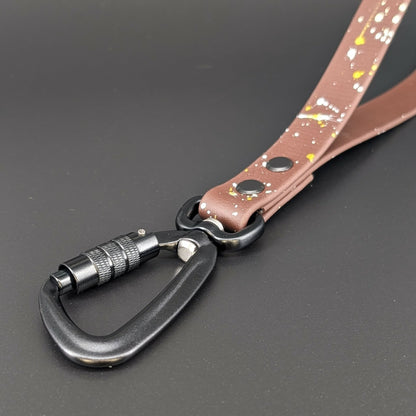 black carabiner on dark brown biothane traffic handle