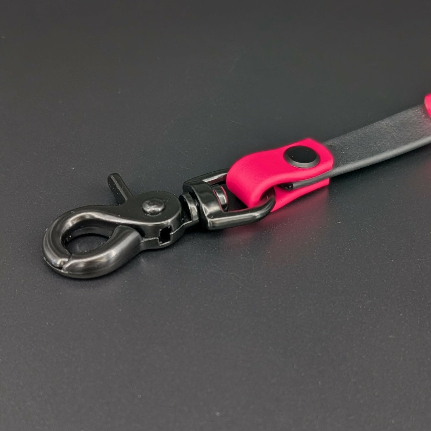 black hardware on black and pink biothane prong collar backup clip