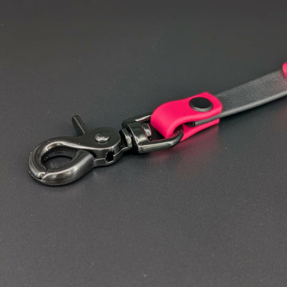 black hardware on black and pink biothane prong collar backup clip