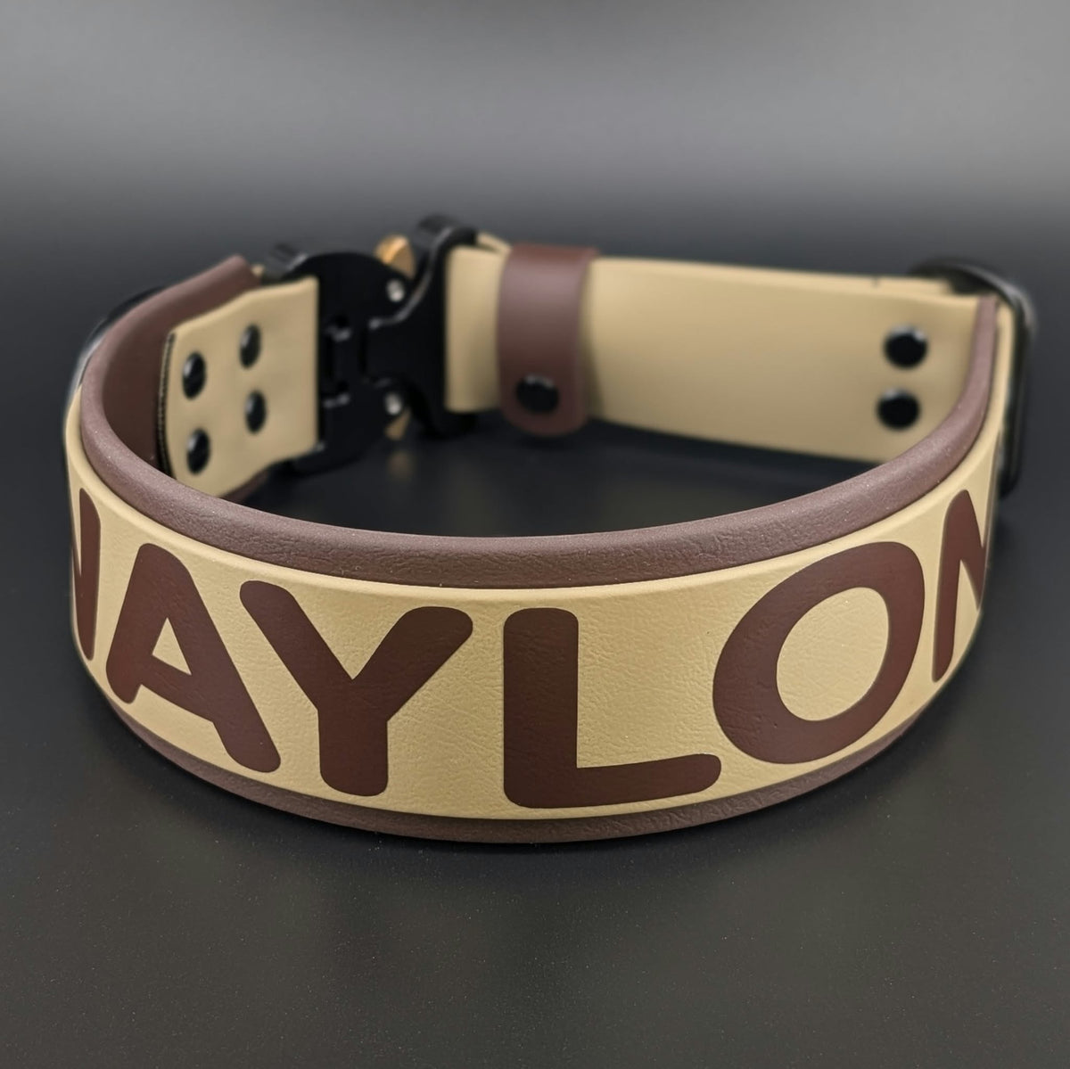 custom 2 inch wide dark brown and tan layered biothane dog collar with black quick release cobra buckle and personalized text