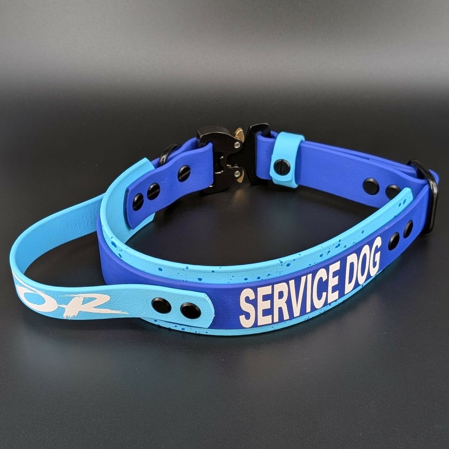 custom light blue and royal blue layered biothane service dog collar with handle and quick release cobra buckle and splatter paint
