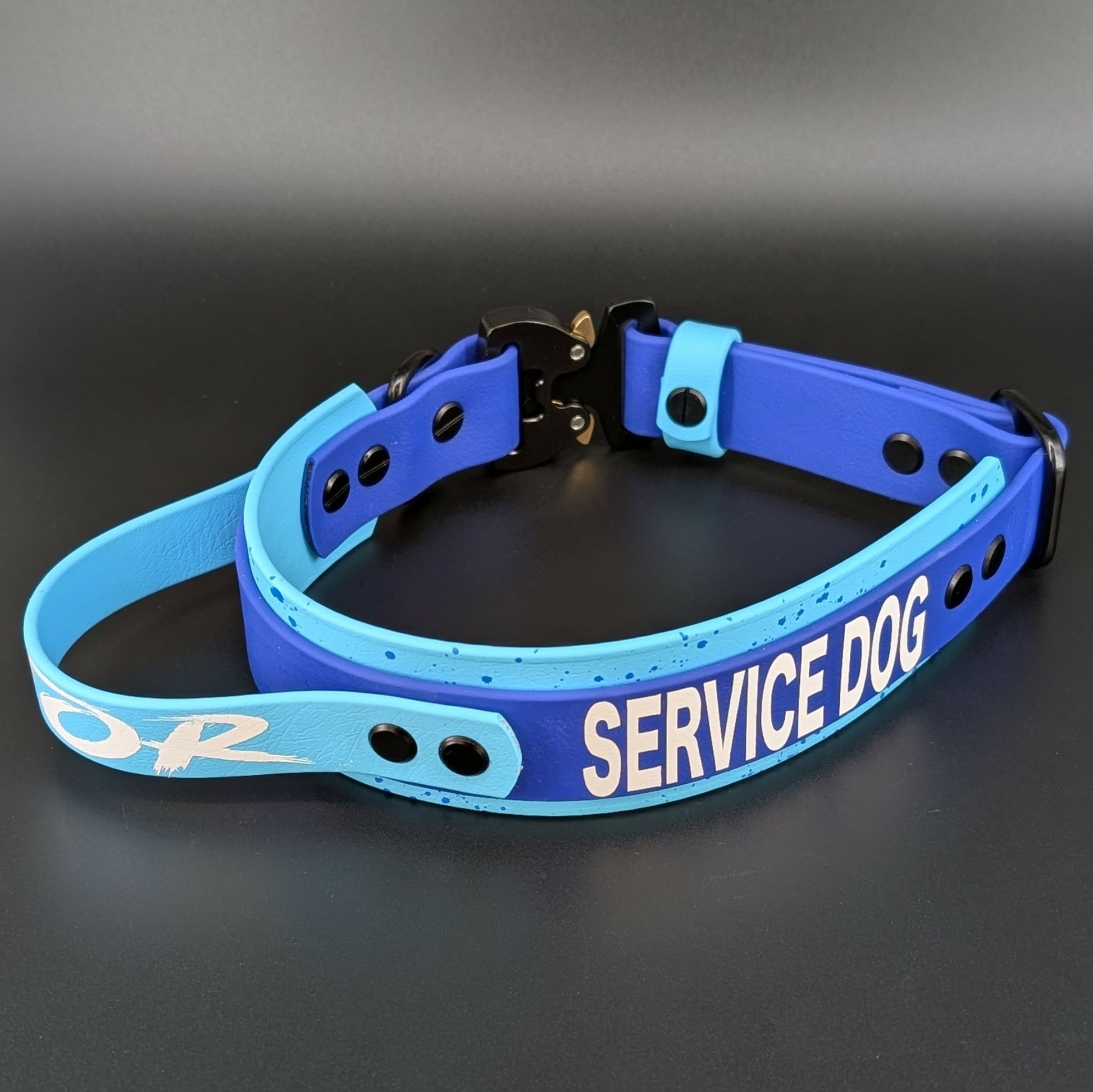 custom light blue and royal blue layered biothane service dog collar with handle and quick release cobra buckle and splatter paint