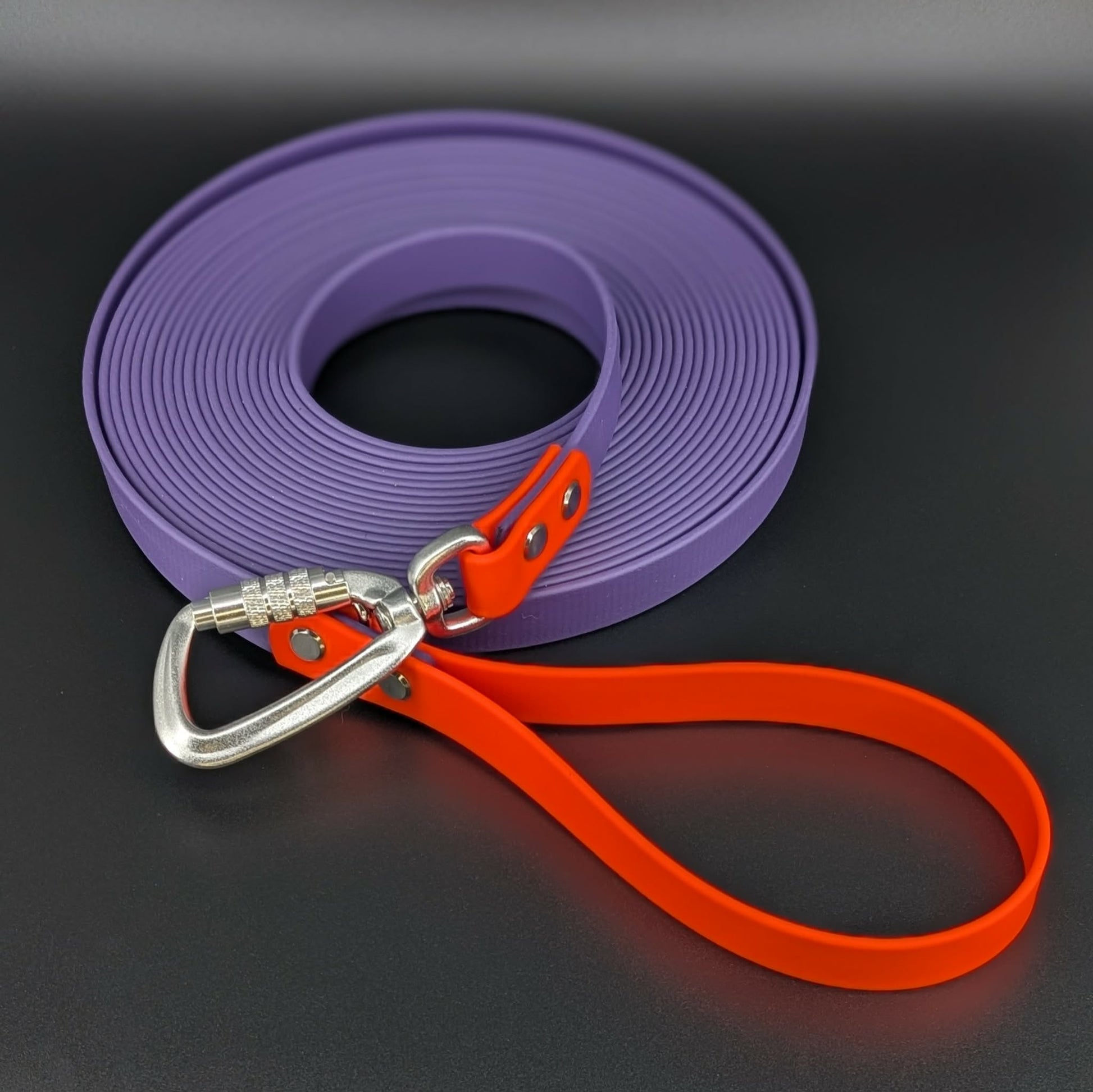dark purple and orange biothane long line with auto locking carabiner clip
