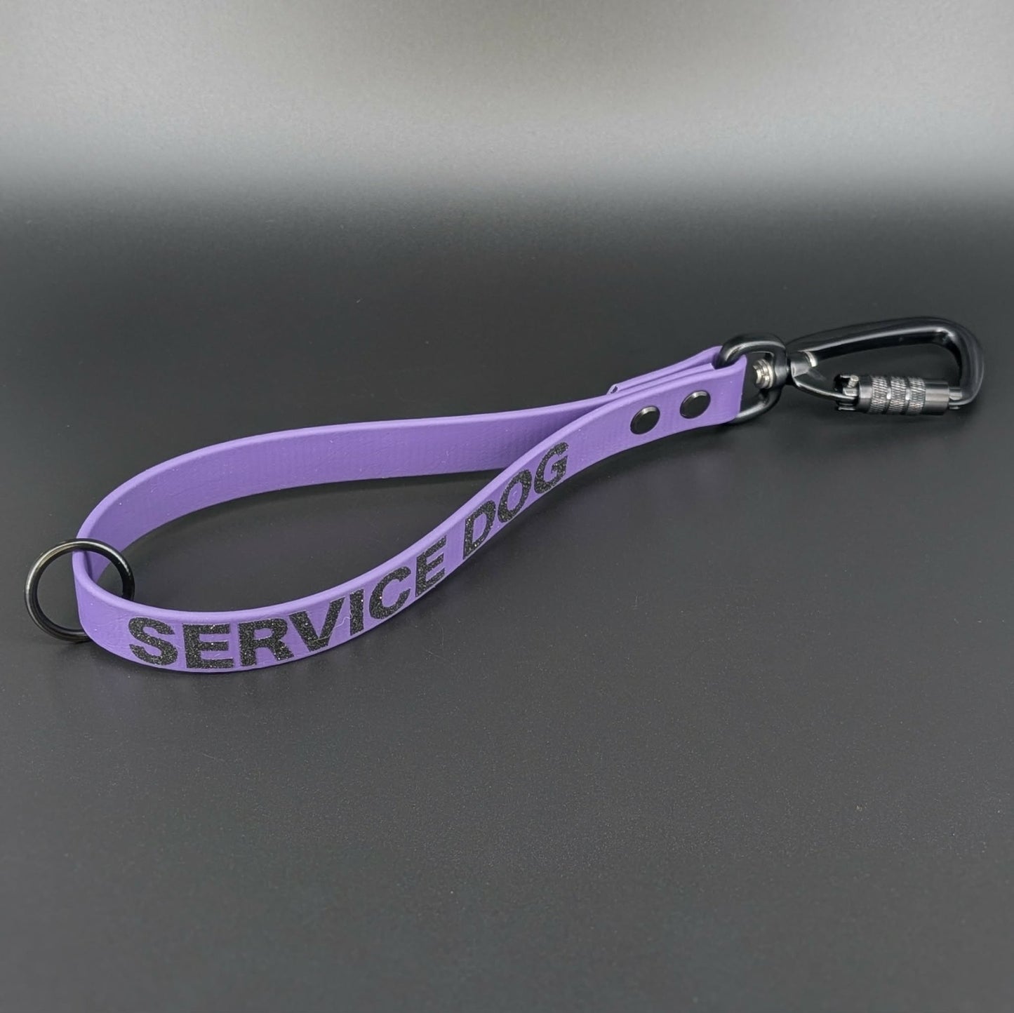 dark purple biothane traffic handle with black carabiner clip and service dog text