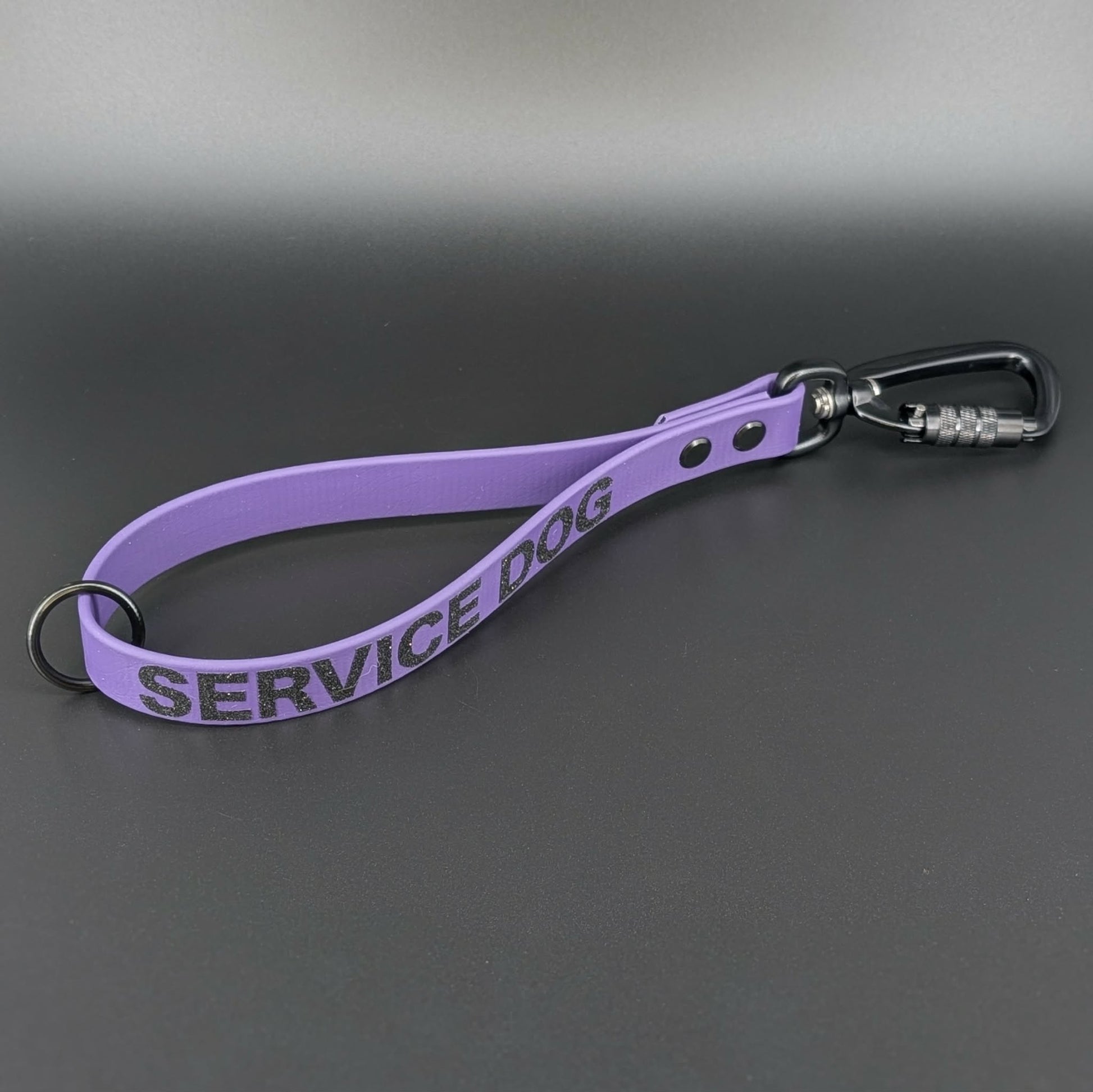 dark purple biothane traffic handle with black carabiner clip and service dog text