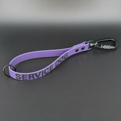 dark purple biothane traffic handle with black carabiner clip and service dog text