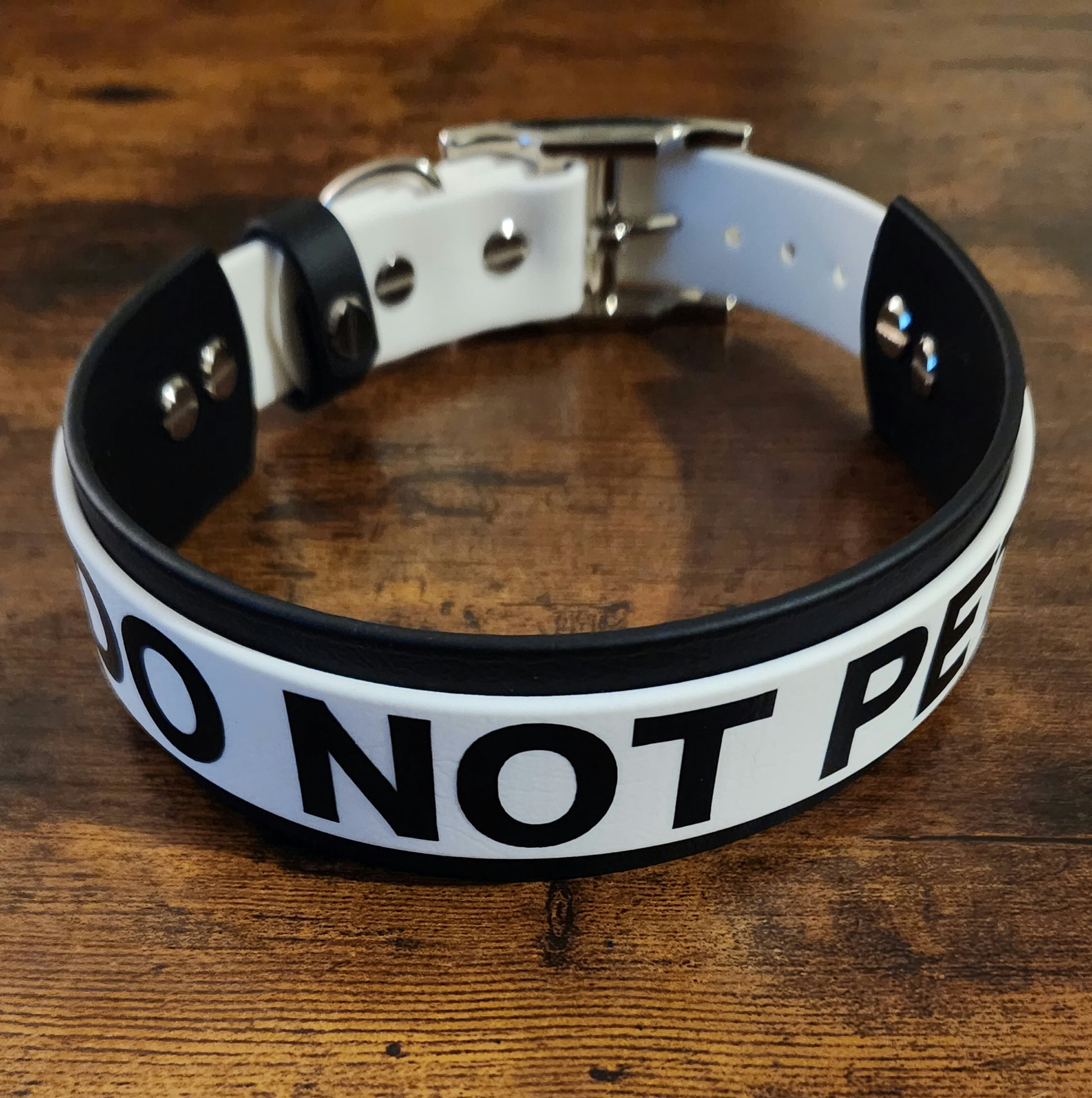 black and white layered biothane dog collar reading "DO NOT PET"