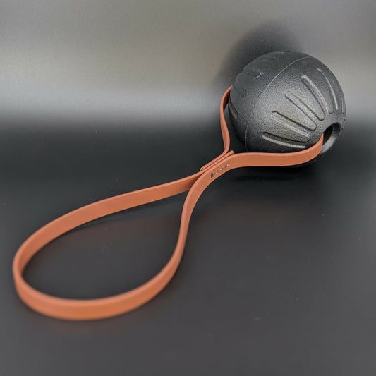 large black eva foam ball tug with brown biothane loop handle