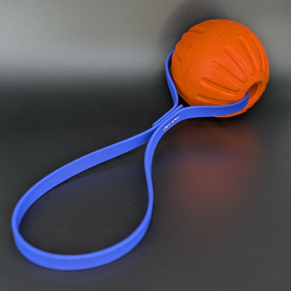 large orange eva foam ball tug with royal blue biothane loop handle