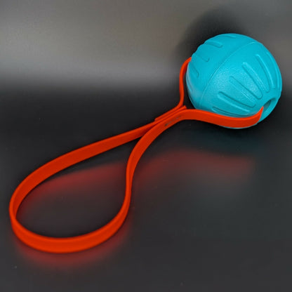 large teal eva foam ball tug with orange biothane loop handle
