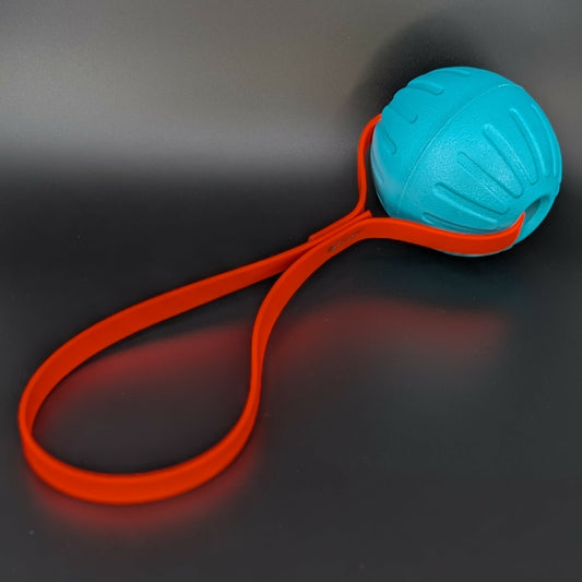 large teal eva foam ball tug with orange biothane loop handle