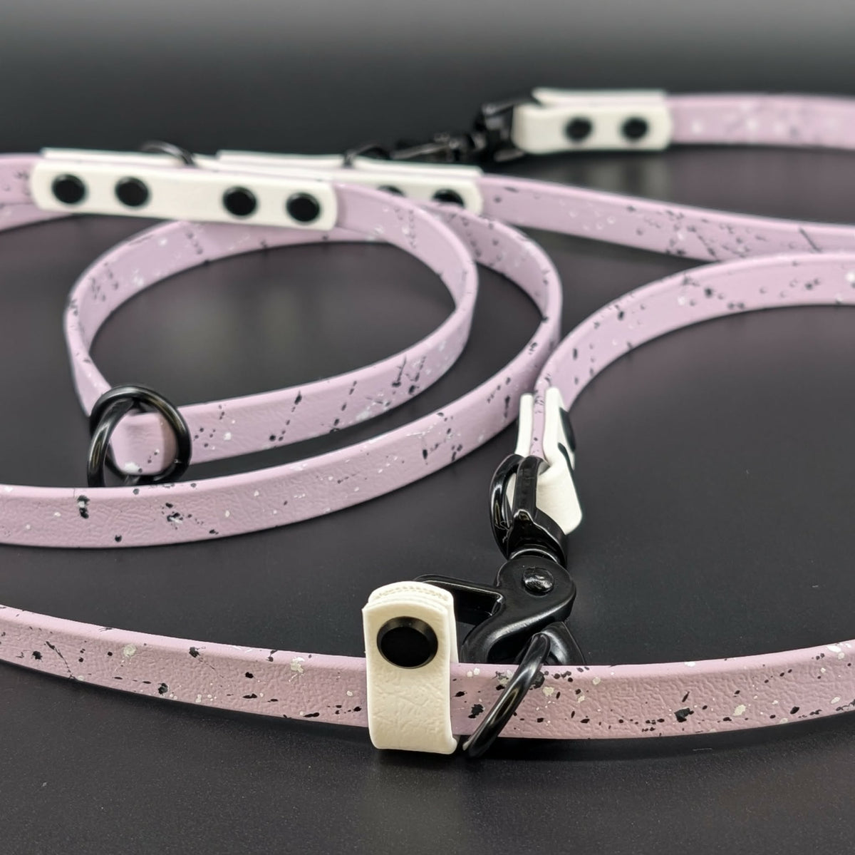 lavender and white biothane hands free over the shoulder dog leash with splatter paint
