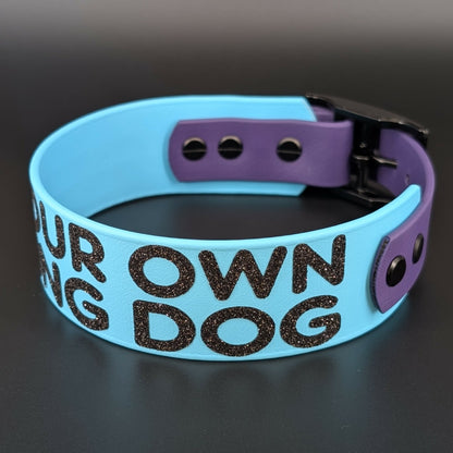 light blue and dark purple tapered biothane dog collar with glitter text