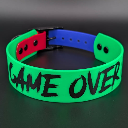 light green and royal blue and red tapered biothane dog collar with game over text