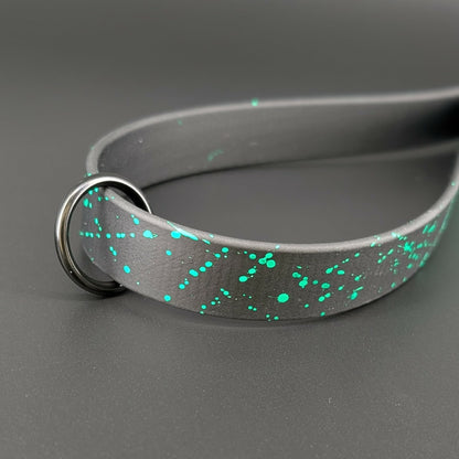 light green splatter paint on black biothane traffic handle