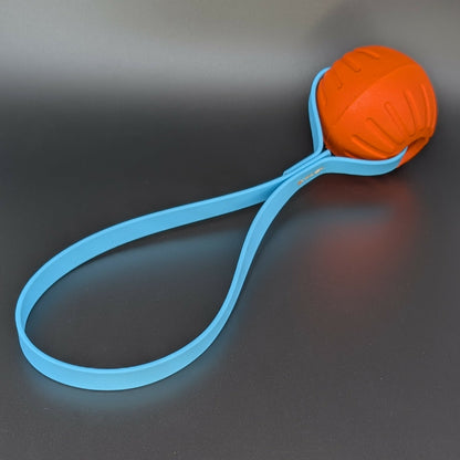 medium orange eva foam ball tug with light blue biothane loop handle