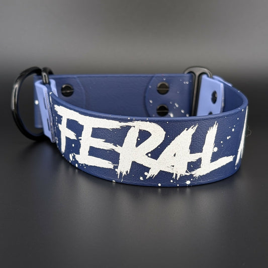 navy blue and periwinkle blue biothane limited slip collar with splatter paint and glitter feral af text
