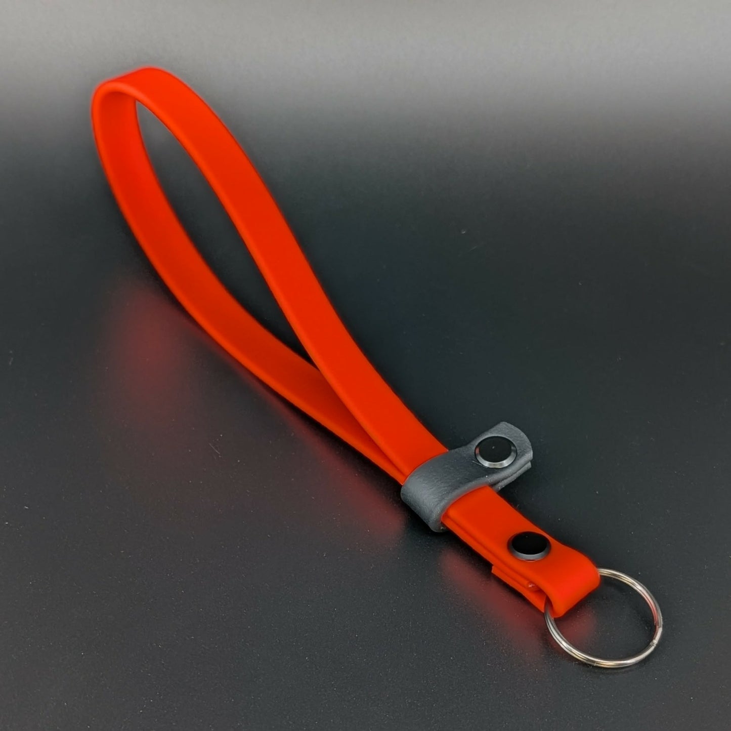 orange and black biothane wrist strap for e-collar remote