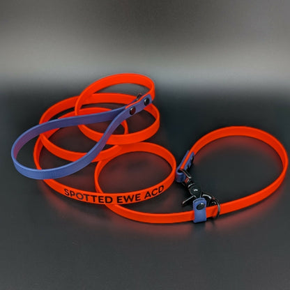 orange and navy blue biothane slip lead with convertible quick release clip and custom text