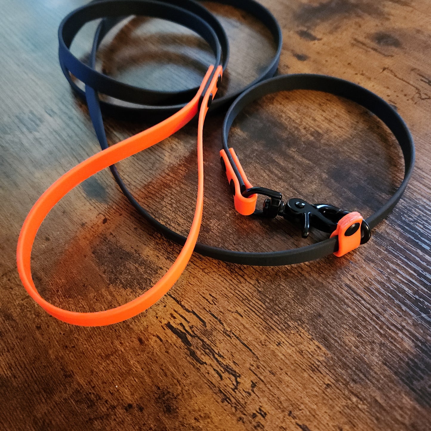 orange and black biothane clip slip leash