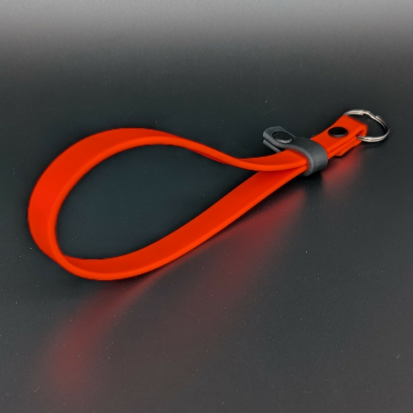 orange with black accent biothane wrist strap for e-collar remote