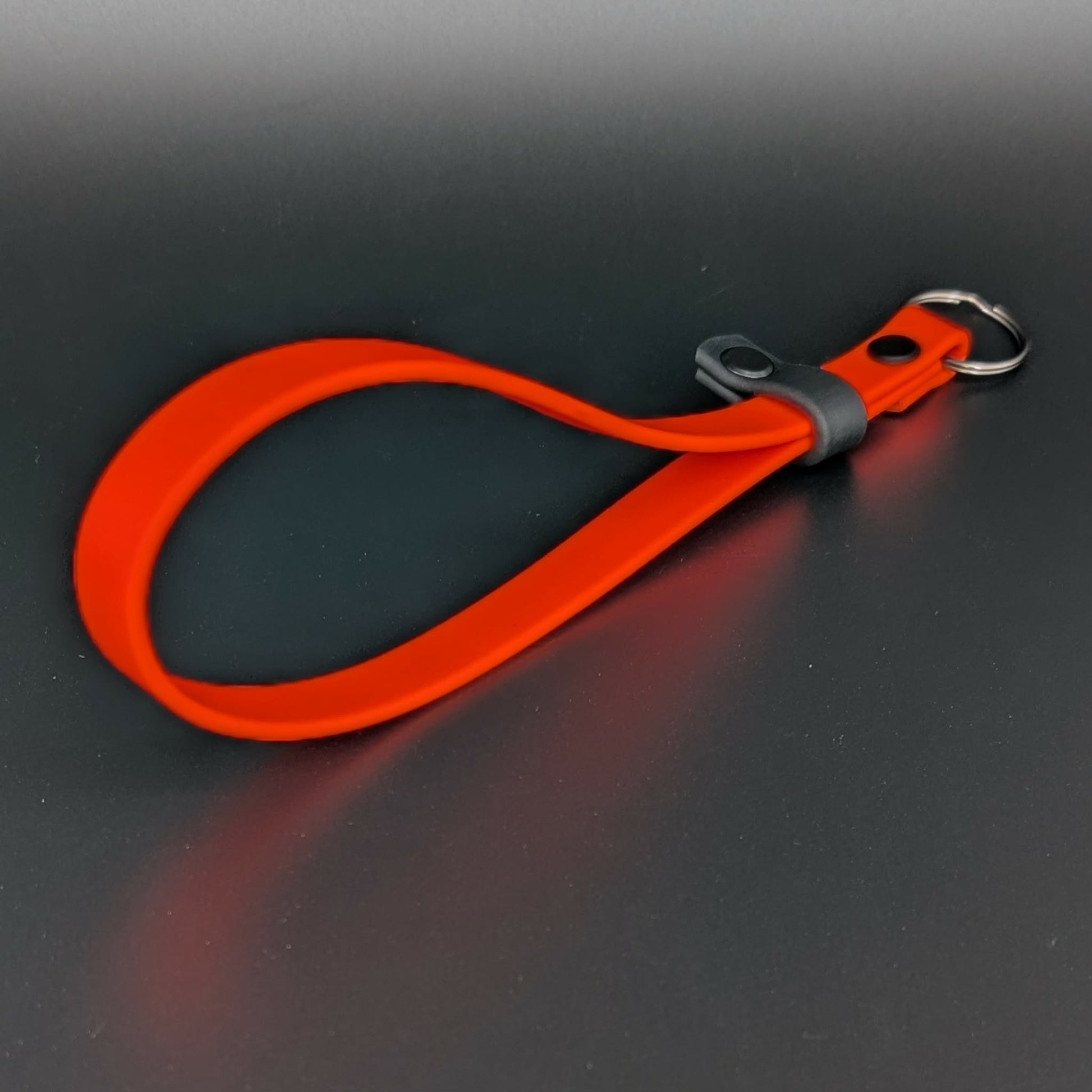 orange with black accent biothane wrist strap for e-collar remote