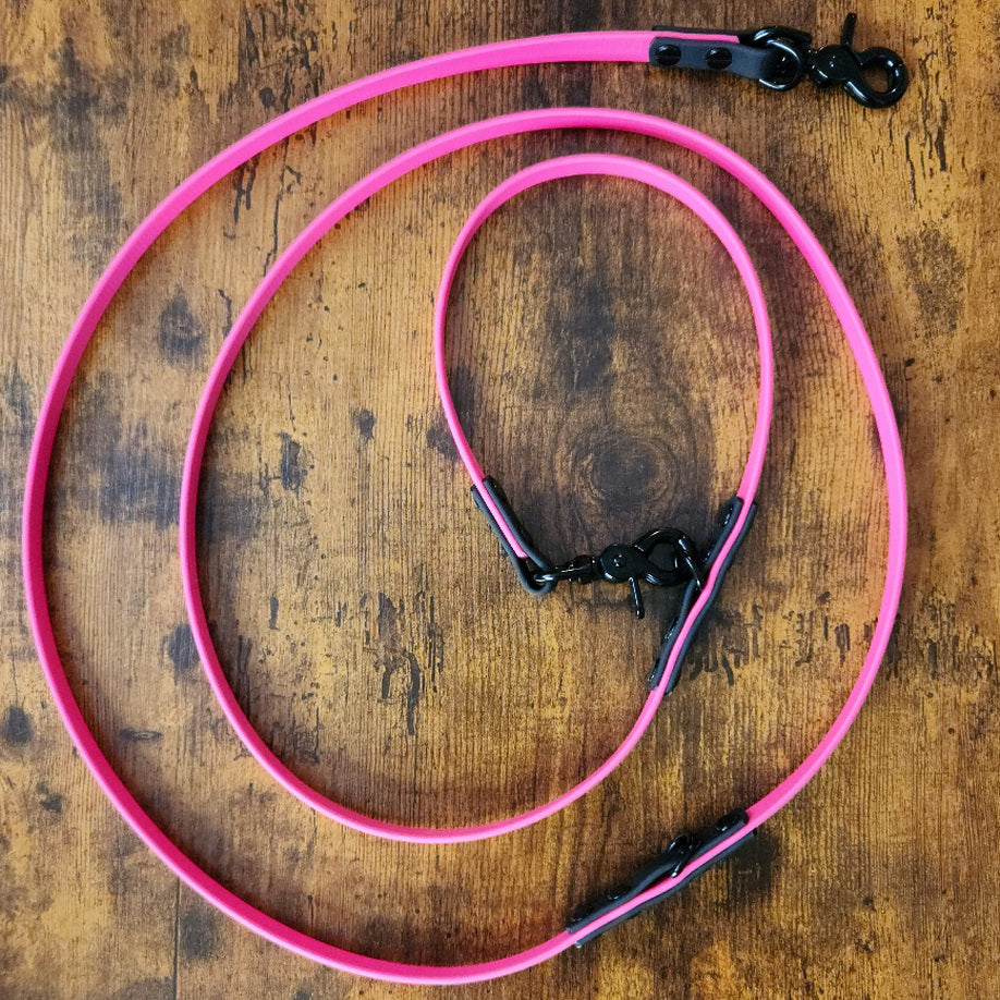 pink and black biothane hands free over the shoulder dog leash