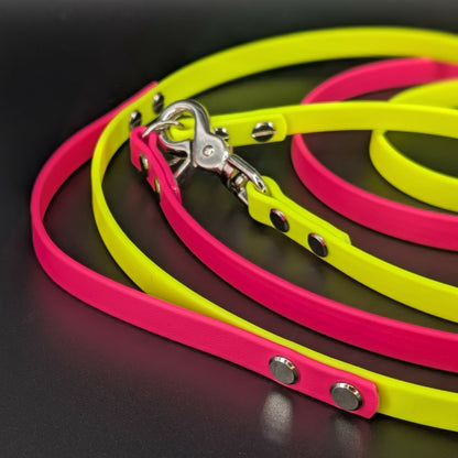 pink and yellow biothane hands free dog leash with built-in traffic handle