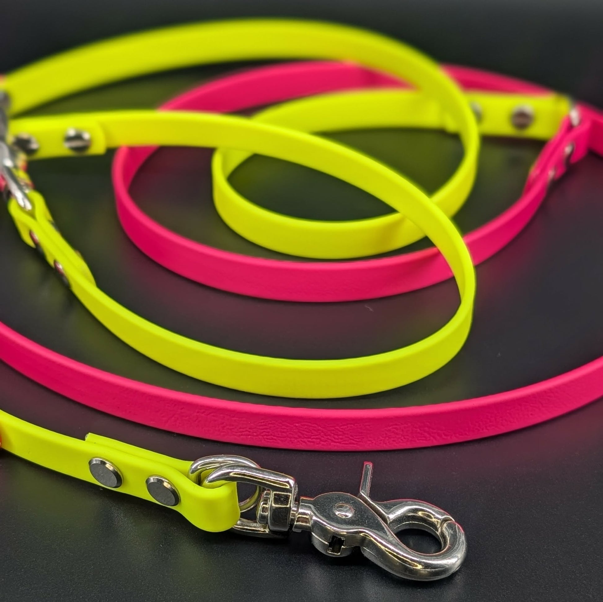 pink and yellow biothane hands free dog leash with silver trigger snap