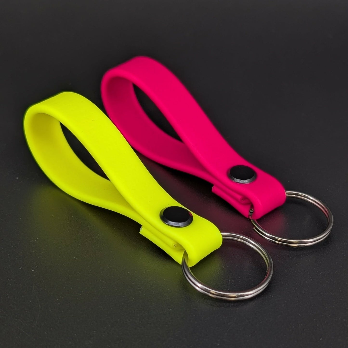 pink and yellow biothane key ring tabs