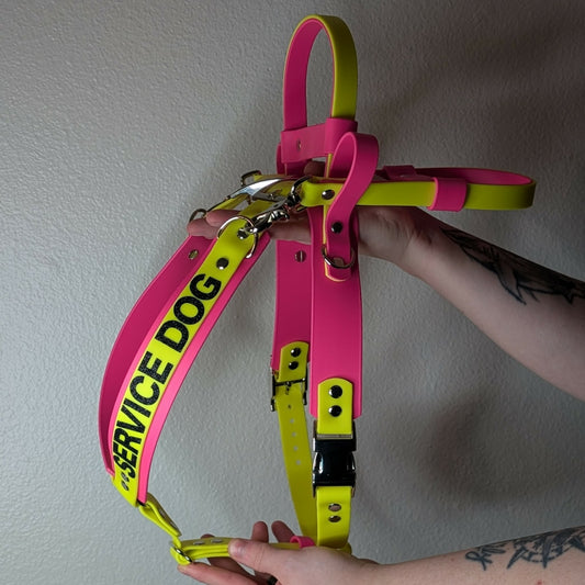 pink and yellow biothane mobility service dog harness with counterbalance handle and pull strap